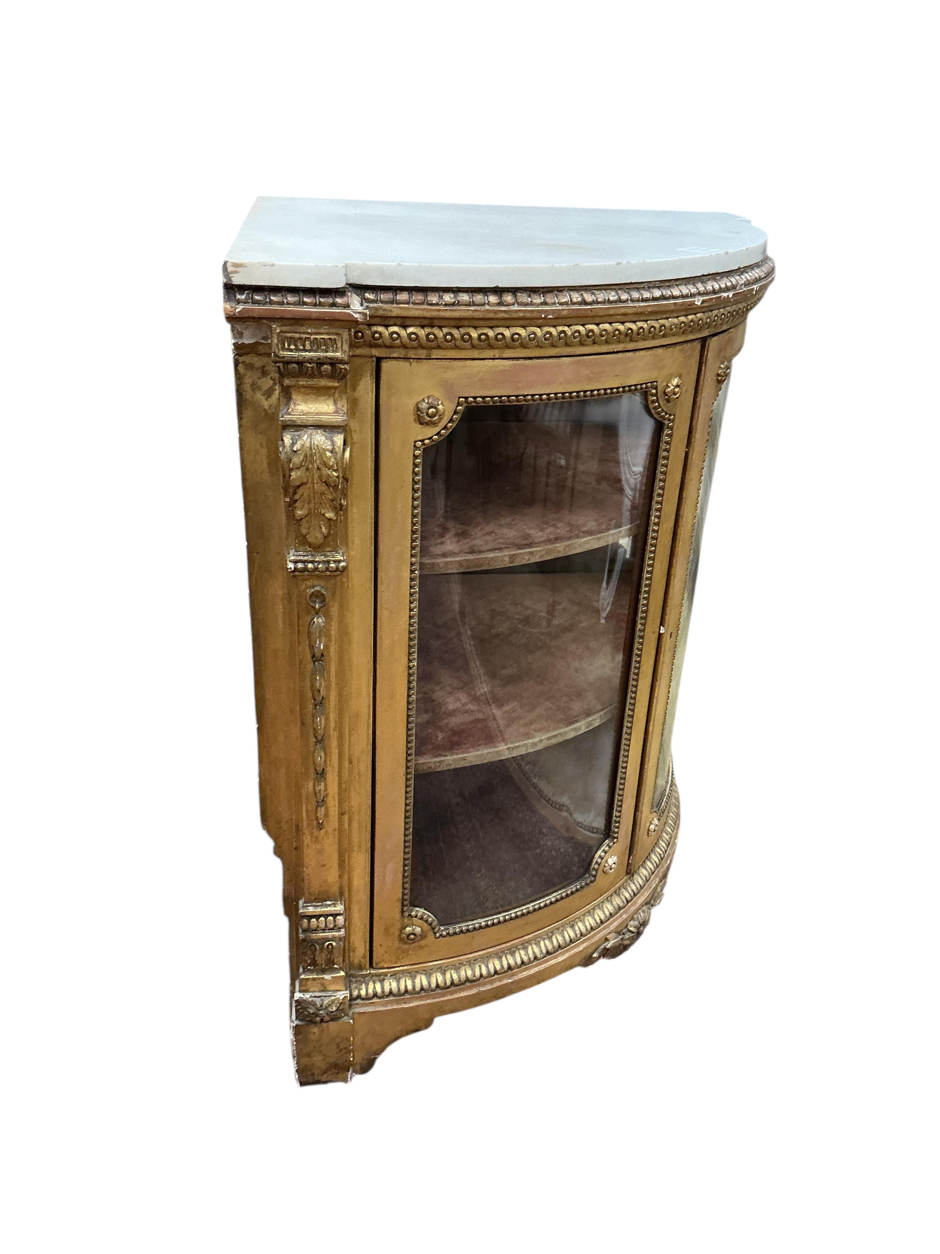 A Louis XVI style giltwood and composition marble topped corner cabinet, width 94cm, depth 69cm, height 95cm